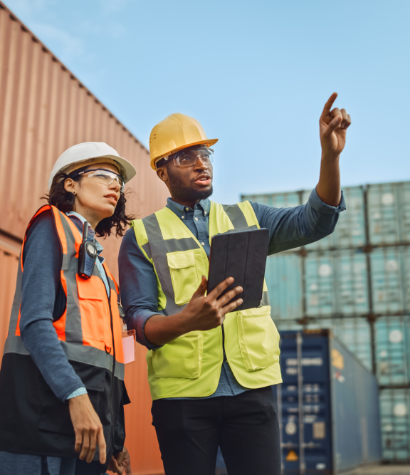 two people in a container yard