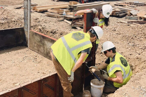 Men at construction site wearing yellow vests