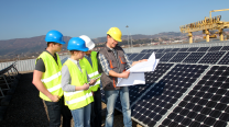 Workers Inspecting Solar Panels